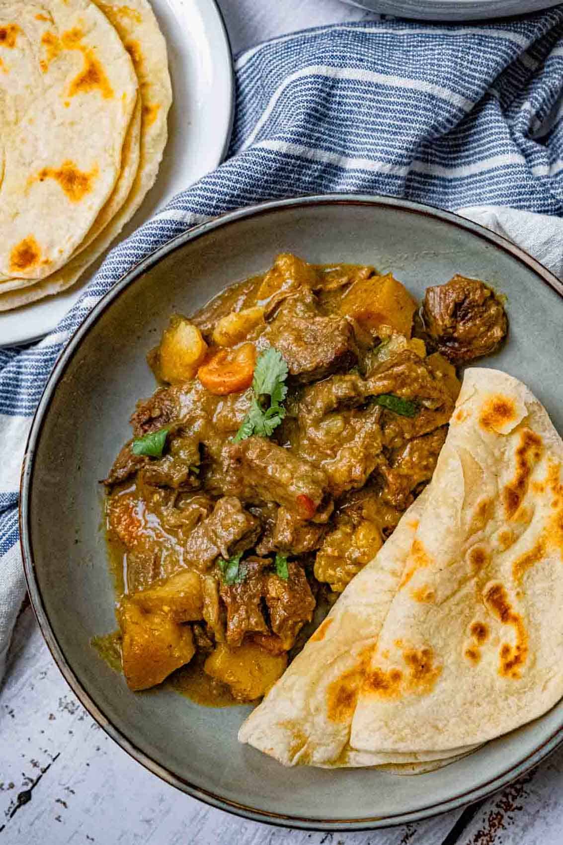 Slow-simmered beef stew w/ soft ghee rotis